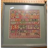 A small alphabet sampler, framed