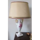 A Kaiser table lamp decorated pink flowers