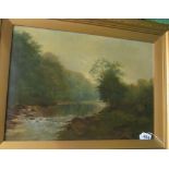 An oil on canvas river with water over rocks, in gilt frame