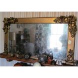 A gilt overmantel mirror with leaf corners