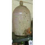 A pottery wine dispenser