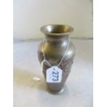 An oriental brass vase