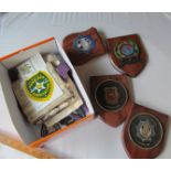 A box of Police plaques, photos, badges etc