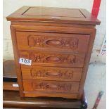 A modern oriental four drawer jewellery chest with carved prunus blossom