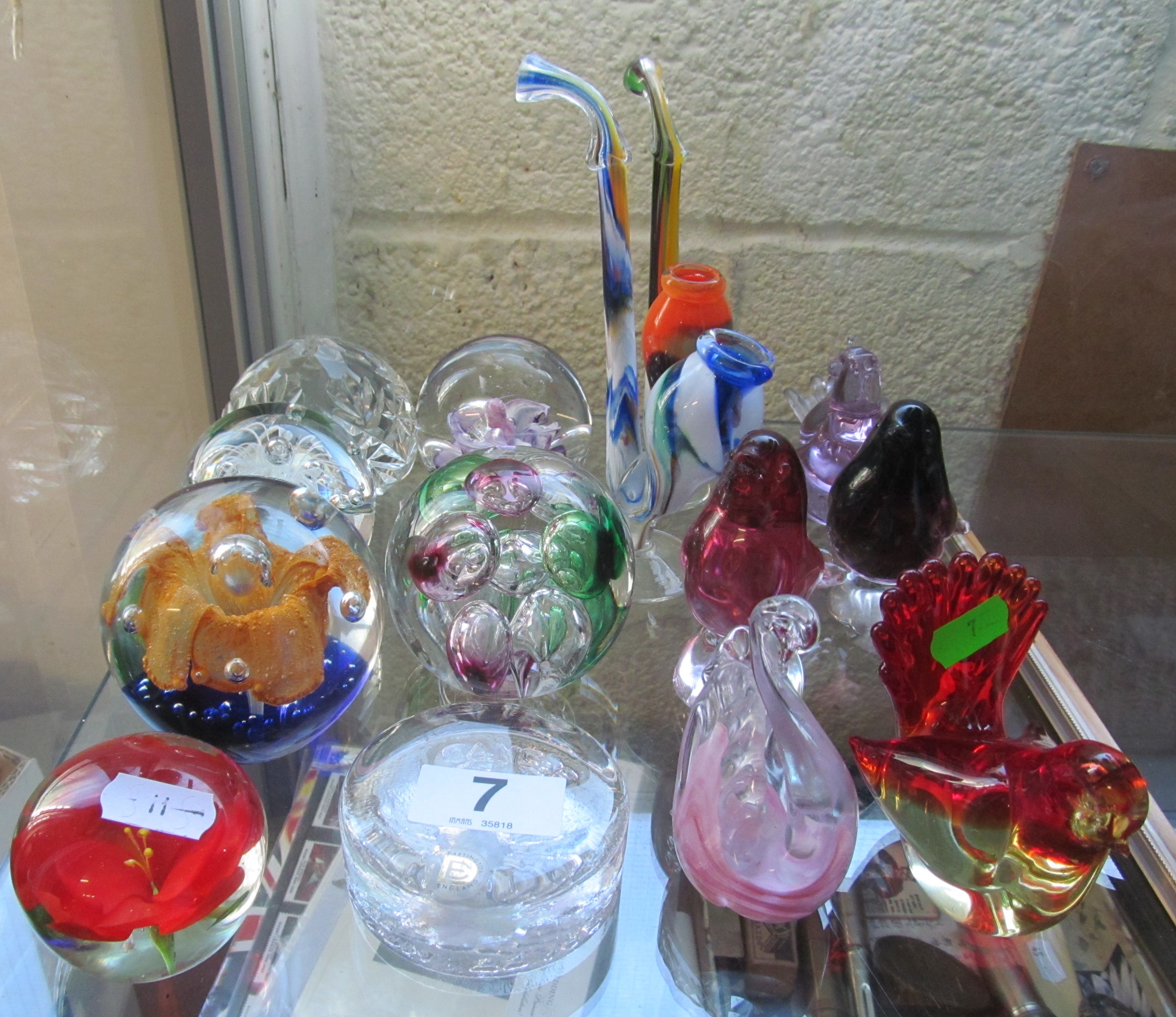 Seven glass paperweights, two glass pipes and various glass birds