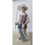 A Lladro figure boy with fishing rod, another girl with pig and a Lladro goose