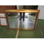 A rectangular gilt mirror