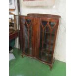 A walnut display cabinet