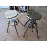 A chrome finish modern industrial style stool and another bronze finish stool