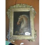 A small oil on canvas laid on board of rearing horse, in gilt frame