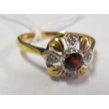 An 18ct gold cluster ring centre red stone and four illusion ring, size O 2.9g