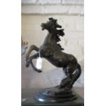 A bronze finish model rearing horse