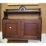 A mahogany wall cabinet