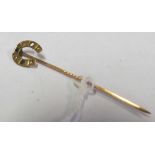 A 9ct gold horseshoe stick pin (i.c)