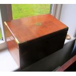 An oak box with shaped top and drawer to side