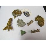 A Royal Corps of Signals brooch and a small group of other military badges
