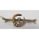 An Edwardian gold bar brooch with diamond and seed pearl crescent