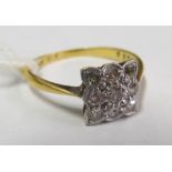 An 18ct and platinum square illusion cluster ring