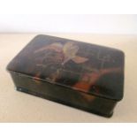A tortoiseshell effect box decorated lacquered bird
