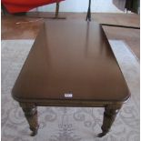 A mahogany rectangular coffee table on fluted supports