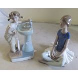 A Lladro figure girl at sink no.4838 and Lladro seated ballet dancer
