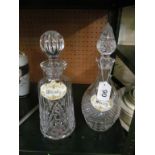 Two decanters with labels