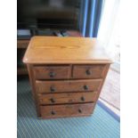 A small pine chest two short and three long drawers
