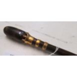 A walking cane with tortoiseshell effect terminal and yellow metal bands, stamped J.H.