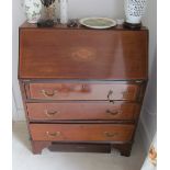 An Edwardian mahogany bureau three drawers
