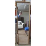 A long gilt wall mirror