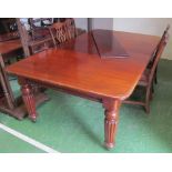 A Victorian mahogany extending dining table (with 3 extra leaves)
