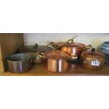 Some copper pans and lids