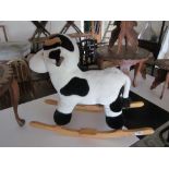 A small rocking toy cow