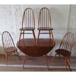 A light wood Ercol table and four chairs (one a/f faded top rails and slightly loose on back)