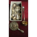 A plated ladle, some cutlery and a silver backed mirror embossed rose design