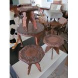 Three small carved eastern tables and a similar circular occasional table