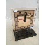 An Art Deco style clock pink glass and battery movement