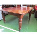 A Victorian mahogany extending dining table (with 3 extra leaves)