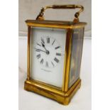 A brass carriage clock with strike