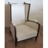 An Edwardian mahogany nursing chair (missing castor)