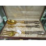A cased Continental three piece spoon and fork set