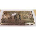 A plated cigarette case in the form of One Hundred dollar bill