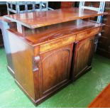 A Victorian mahogany chiffonier base with two drawers and two cupboards and a rising top