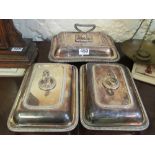 A pair of silver plated entree dishes with gadrooned borders and another slightly larger