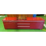 An Ikea pink low sideboard