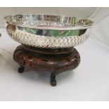 A large modern Sheffield silver bowl with pierced band 27ozs on oriental hardwood stand