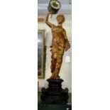 A gilt spelter clock of lady holding clock face