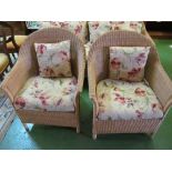 A cane conservatory suite of two seater settee and two armchairs
