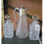 A claret jug and two decanters