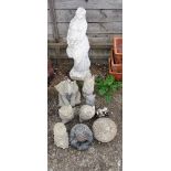 A garden statue semi-naked lady and small animal garden ornaments